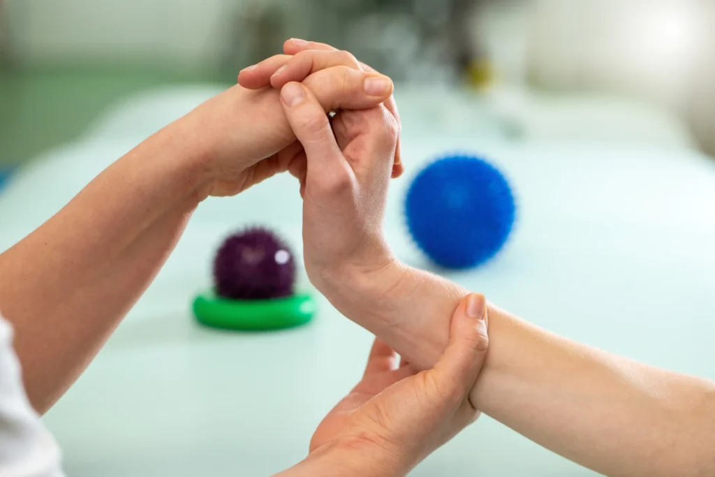 hand being manipulated with therapy balls nearby 2026 01 06 10 56 43 utc